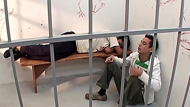 Locked up and horny, young Latino Ramiro wakes up his cell mate by groping his cock.