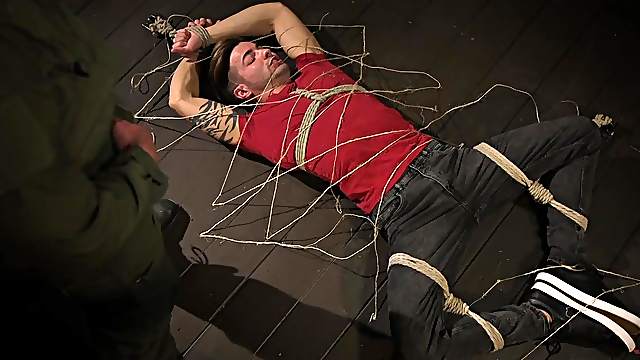Kinky gay couple in a blindfolded blowjob session in the dungeon