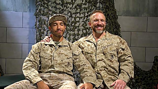Kinky bondage gay session with an interracial army men couple