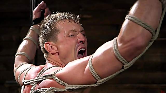 Gay dungeon fetish session with buffed dudes wearing leather