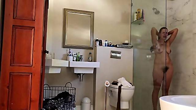 Nice view via my hidden camera on her sexy body, her firm tits, her hairy cunt.
