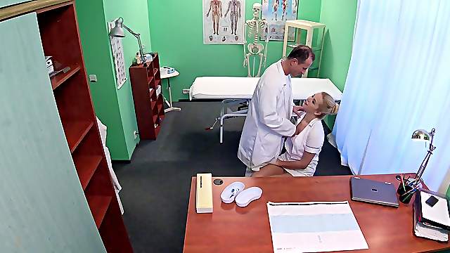 Doctor and his nurse are feeling a bit horny and decide to have sex
