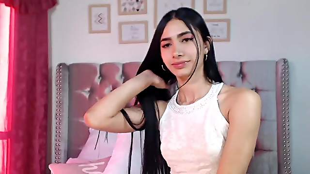 Beautiful long haired brunette Latina amateur teen with spreaded legs in bed