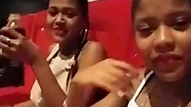 Two Latina girls at cinema