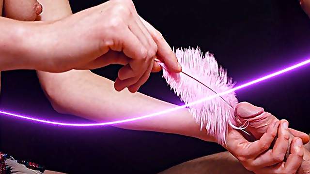 Girl tickled boyfriend with a fluffy feather