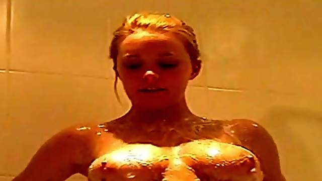 Sweet chick Chesney loves rubbing her boobs and pussy in the shower