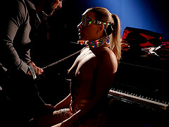 Blonde bombshell Anna Claire indulges in a kinky BDSM session with her loyal slave
