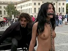 Kinky brunette walks naked in the street and gets fucked