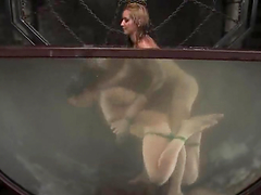 Gorgeous brunette gets toyed by a blonde in water bondage video