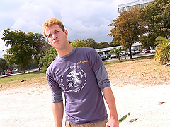 Affectionate gay in t-shirt moaning while being given blowjob