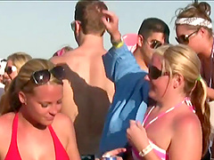 Party girls in and out of their bikinis while having fun at the beach