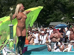 Naughty nude blonde amateur with long hair getting wild in public party outdoor