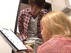 A pretty blonde Japanese girl plays with toys and a guy's cock