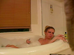 She plays hot in her bathing tub