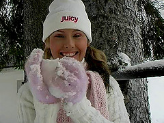 An adventurous hottie rubs snow against her shaved pussy