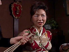 Asian mature bitch has a rope session to endure