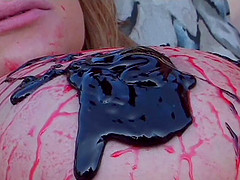 Couple covered in strawberry and chocolate sauce fucks outdoors