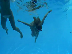 Swimming together in the pool before licking each other's pussies