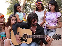 Flamboyant guy with a beard gives the brunette a cock to bounce on