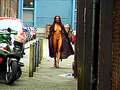 Good-looking ebony babe flashing her tits and pussy in public
