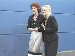 Blonde and a brunette join a bunch of men for a gangbang