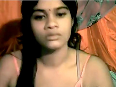 Dark indian beauty does a striptease for the webcam