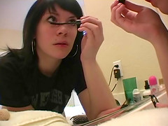 Long hair Andy dressing up infront of bedroom mirror