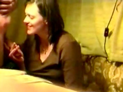 A chubby brunette milf giving some guy head without any idea she is being filmed.