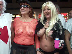 The first woman youll see here is naked, but her body is painted to look