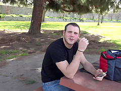 Gay college student Levi takes of his shirt in a park and sucks dick