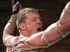 Gay dungeon fetish session with buffed dudes wearing leather