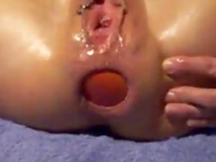 Apple-Insertion inserting an apple into a stretched ass