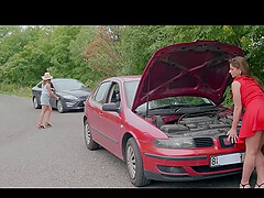 Two blondes have a broken car